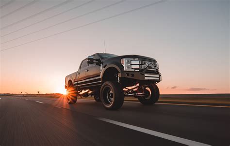 Black Lifted Ford F 350 Crew Cab Truck On Road At Daytime Truck