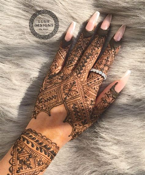 Brown Henna Design With A Ring And Press On Nails And A Grey Fur
