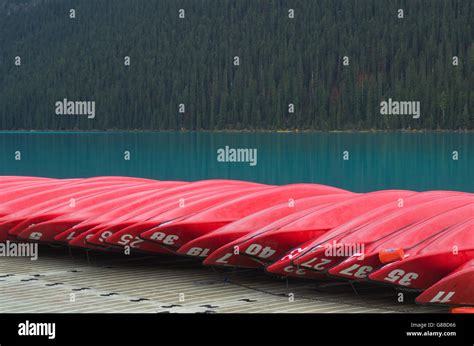 Red Canoes On Dock Lake Louise Banff National Park Stock Photo Alamy