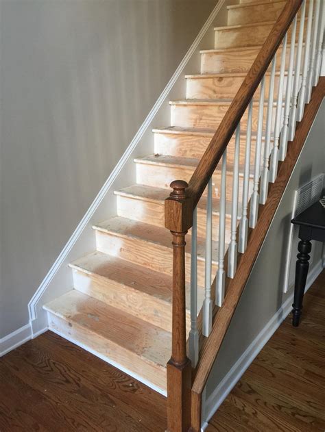 I finally tackled those outdated ugly orange oak stair banisters! Black staircase treads and railing - 2 Cabinet Girls
