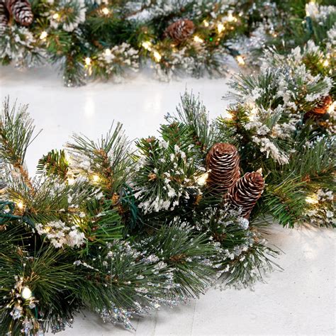 National Tree 9 X 10 Glitter Pine Garland With Cones Snowflakes And