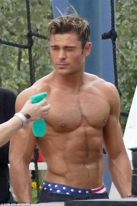 zac efron shirtless as he flexes his bulging biceps for baywatch filming daily mail online