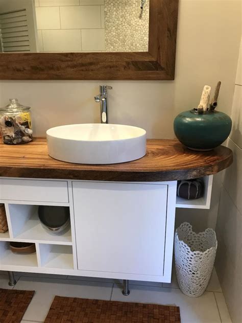 Take your bathroom to a whole new level by updating or replacing the vanity. Live edge natural monkeypod slab bathroom counter with ...