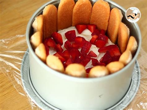 A Cake In A Tin With Strawberries On Top