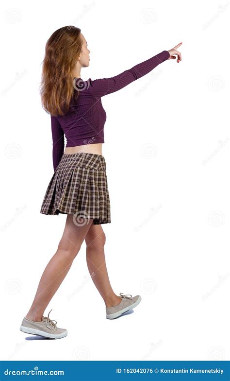 Back View Of Walking Woman Beautiful Girl Pointing Stock Photo Image