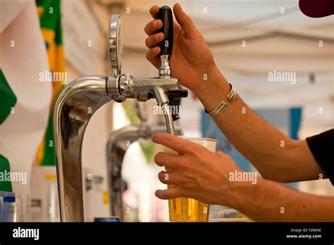 Bartender Pouring Beer From Tap Stock Photo Alamy