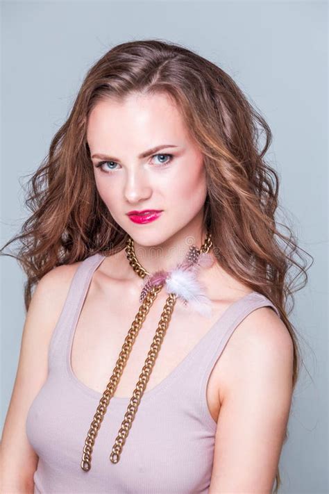 A Beautiful Choker Made Of Gold Chains White And Pink Fluff Around The