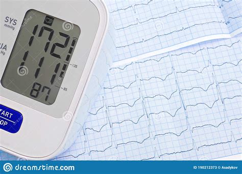 Automatic Blood Pressure Meter On Cardiogram Graph Background Stock