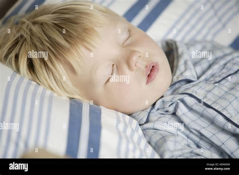 Little Boy Sleeping In His Bed Stock Photo Alamy