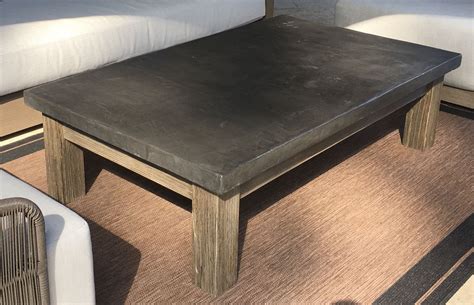 While someone holds the tube steady, pour the concrete along the side of the tube. DIY Concrete top patio coffee table with distressed ...