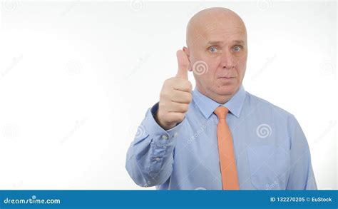 Confident Businessman Make Thumbs Up A Serious Good Job Sign Stock