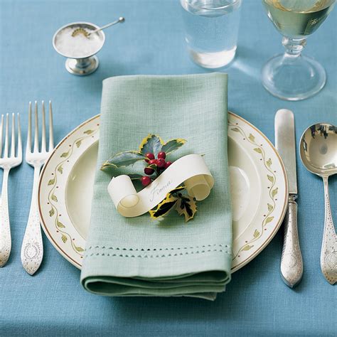 The napkin should be placed on the left side of the forks. Holiday Table Settings | Martha Stewart