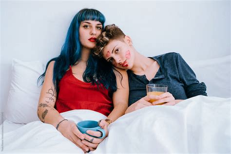 A Couple Of Lesbians In Bed Leave Lipstick Marks On Their Faces By Stocksy Contributor Thais