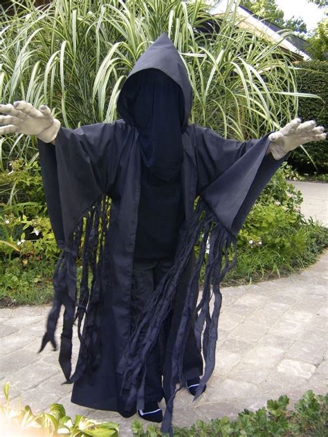 I can sew, but i can't sew, ya know? Very simple Dementor costume. Start with all black clothing. Sew a black "Jedi" robe adding ...