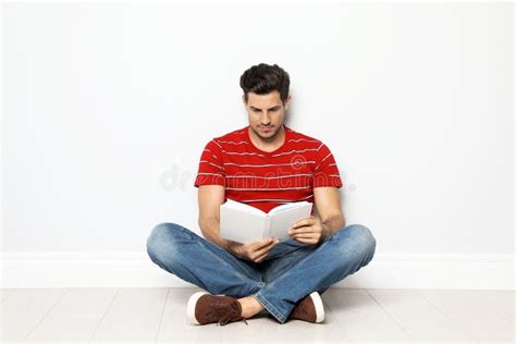 Handsome Man Reading Book On Floor Stock Image Image Of Male Leisure
