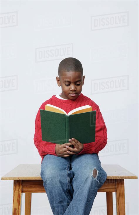 African Boy Reading Book Stock Photo Dissolve