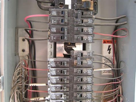 It shows the components of the circuit as simplified shapes, and the power and signal connections between the devices. 220 Breaker Box