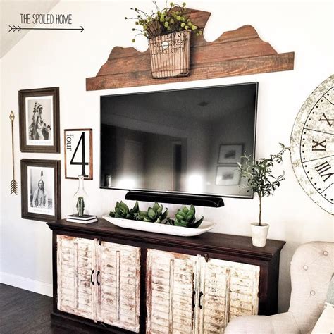 This room takes it all the way with the black stone fireplace and ebony floors. decorating around a tv console decorating around a wall mounted tv how to dec… | Wall decor ...