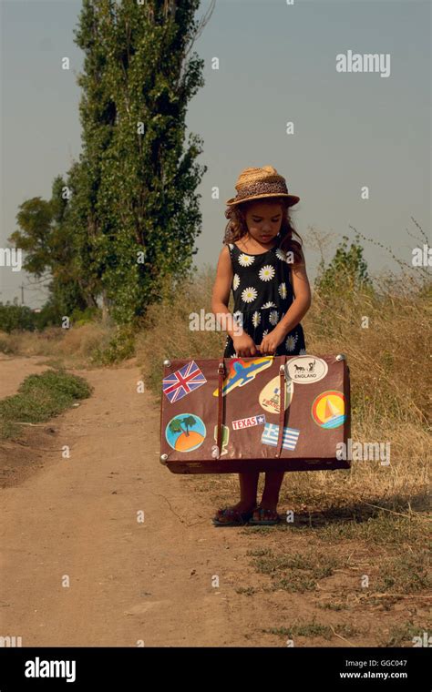 Girl With Suitcase Stock Photo Alamy