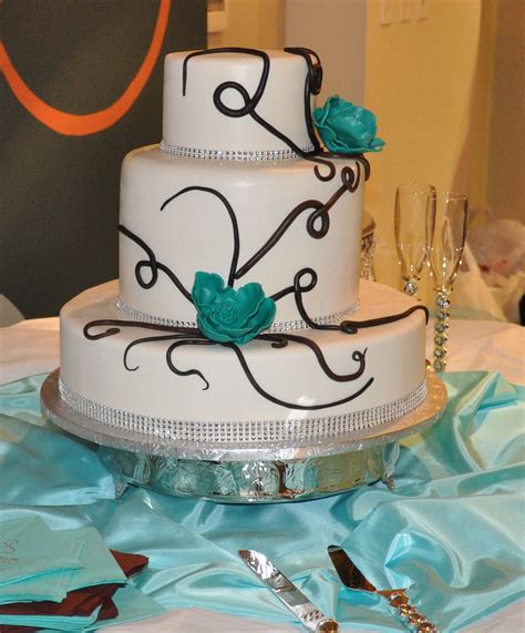 Unique Three Tier Wedding Cake With Turquoise Flower Accents Weddingcake Wedding Cake Designs