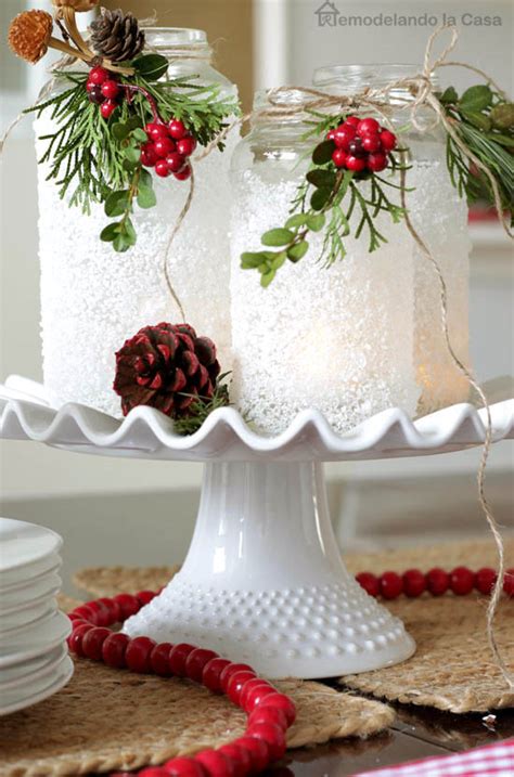 Using paper or painted crafts sticks and paint stirrers, as shown here, hang a grouping of snowflakes up the banister, over the dining table, or from your buffet table. 20 Amazing DIY Christmas Centerpieces