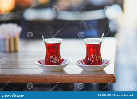 Turkish Tea Served In Tulip Shaped Glasses In Cafe Or Restaurant In