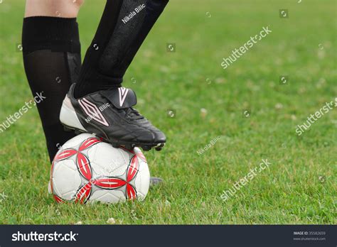 Close Up Image Of Soccer Ball And Cleats With Grass