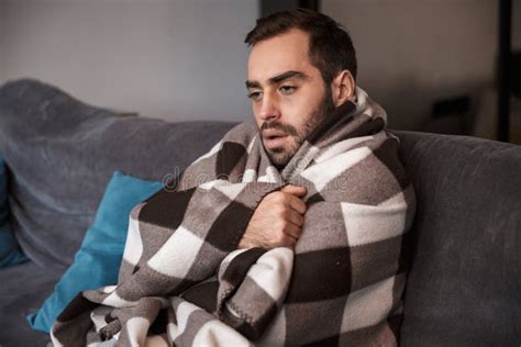 Photo Of Caucasian Man 30s Wrapped In Blanket Having Temperature And