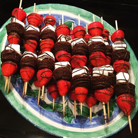 Chocolate Covered Strawberries Are Arranged On Skewers