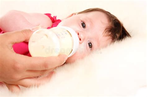 Baby Girl Drinking Milk From Bottle Stock Photos Image