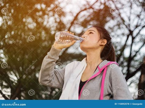 Young Sporty Woman Drinking Water In Park Stock Photo Image Of Health