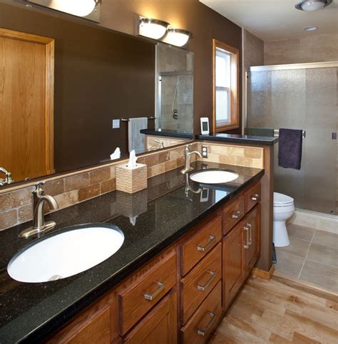 It is attached with adhesive and caulked around the perimeter. Black Granite Vanity Counter - Contemporary - Bathroom ...