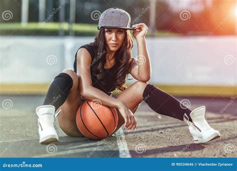 Beautiful Brunette Woman Playing Basketball On Court Outdoor Stock