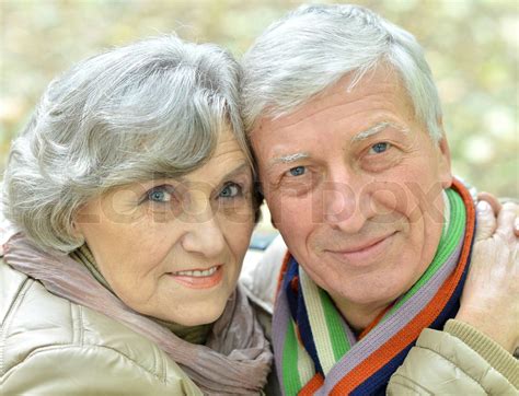 Mature Couple Walking In The Park Stock Image Colourbox
