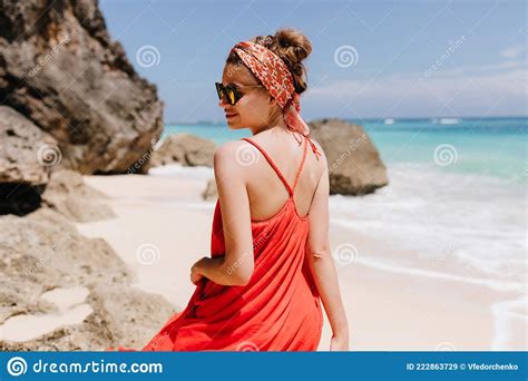 Outdoor Photo From Back Of Attractive Lightly Tanned Girl Wears Trendy