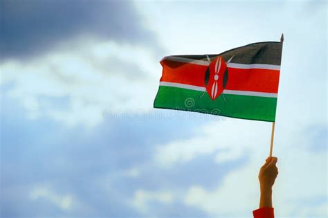 Hand Waving The Flag Of Kenya On The Sky Stock Image Image Of