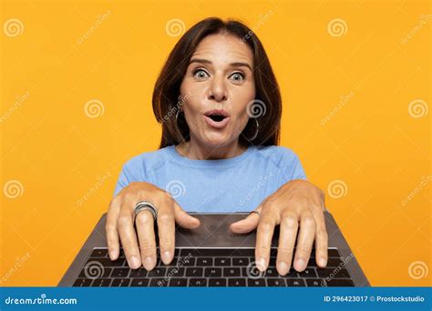 Positive Shocked Funny Senior European Lady Typing On Keyboard Laptop