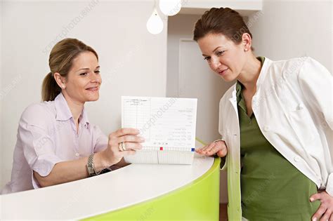 Doctor And Receptionist In Surgery Stock Image F0039718 Science