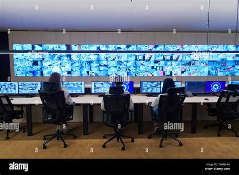 Group Of Security Data Center Operators Working In A Cctv Monitoring