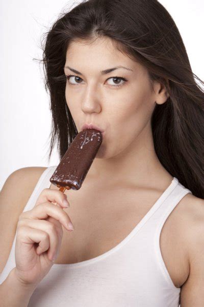 Sexy Brunette Woman Licking Chocolate Ice Cream Stock Photo By Rvas