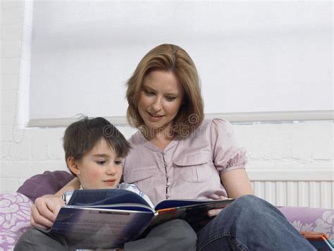 Loving Mother And Son Reading Book On Bed Stock Image Image Of Horizontal Comfortable