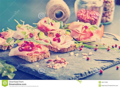 Sliced Prosciutto With Herbs And Pomegranate Seeds Stock Image Image