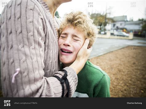 Mother Comforting Her Crying Son Stock Photo OFFSET