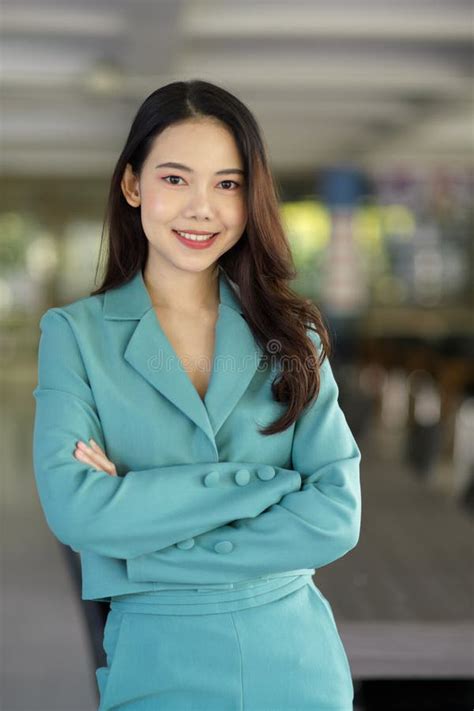 Portrait Of A Beautiful Young Business Woman With Crossed Arms Stock