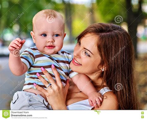 Happy Loving Mother And Her Baby Outdoors Stock Photo