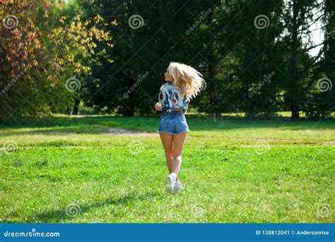 Beautiful Blonde Woman Dressed In A Denim Jacket And Shorts Stock Image Image Of Clothes