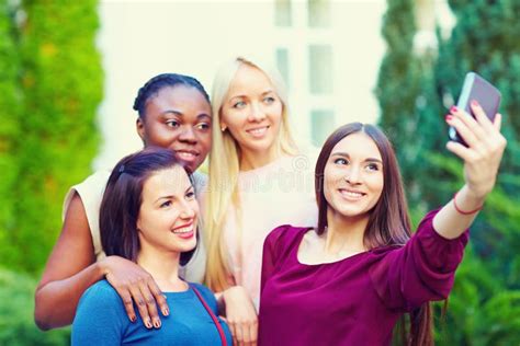 Group Of Multiracial Girls Taking Selfie On Smartphone Stock Image