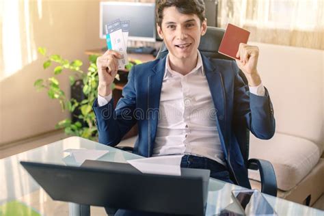 Man Businessman Holding Airline Ticket In Hand And Talking On The Phone