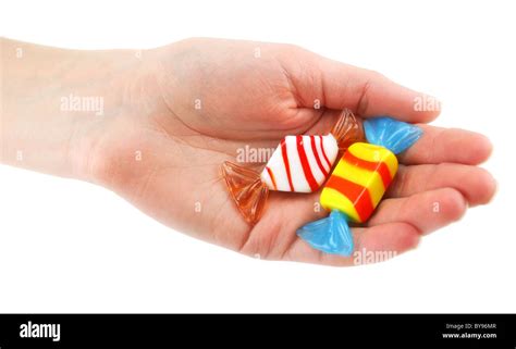Womans Hand Gives Two Colored Candy Stock Photo Alamy