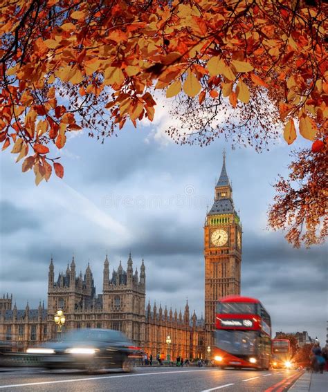 Buses With Autumn Leaves Against Big Ben In London England Uk Stock